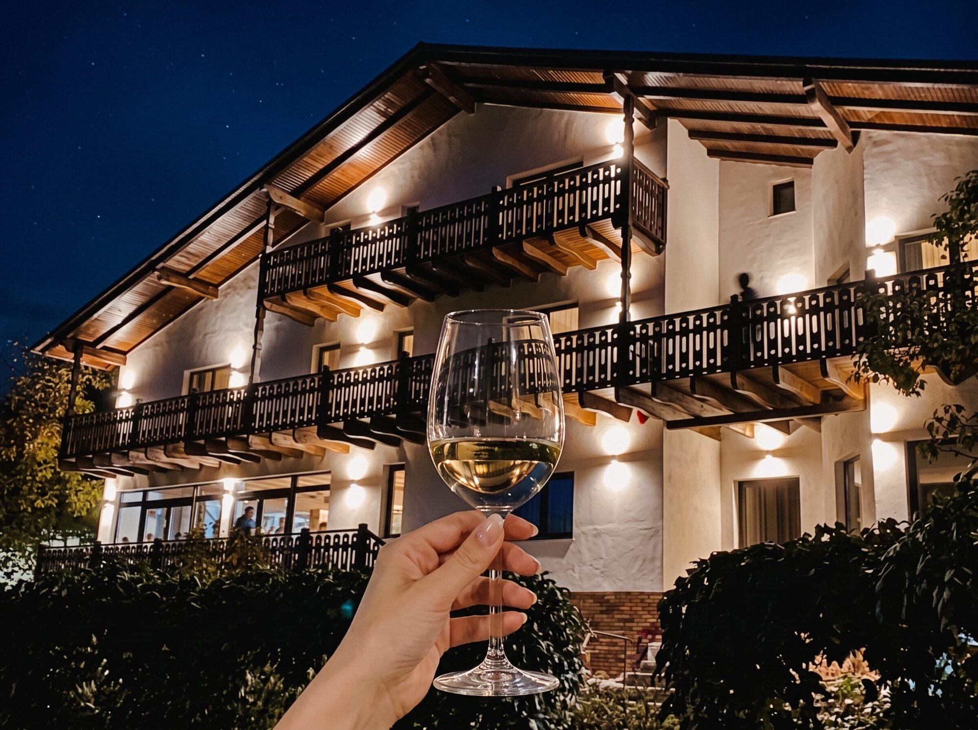 The Panoramic guest house lit at night