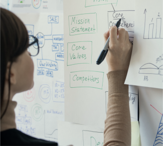 woman writing on a flipboard